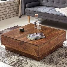 An attractive yet rustic concept, the square wooden glass coffee tables are a very attractive addition that will complete any living room set perfectly. Coffee Tables Buy Wooden Coffee Tables Online In Varying Designs And Size Saraf Furniture