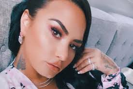 Demi recently teased her twitter followers about the color change up: Demi Lovato Debuts New Butterfly Neck Tattoo Possible New Song Lyrics