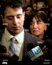 Ann Marie Yanni, right, reacts as she leaves a courtroom with her son Kevin  Eckenrode, left, who talks with the media in Harrisburg, Pa., Friday, Jan.  12, 2007, after a jury convicted