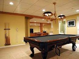 Most recessed can lights come with adjustable mounting arms that can either be nailed between joists, or in your case snapped over the grid main runners. How To Install Recessed Lights In A Drop Ceiling Basement Remodeling Plans Basement Design Basement Remodeling