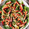 In a salad bowl toss the spinach, tomatoes and apples together. 1