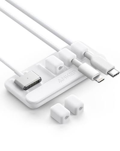 White Anker desktop cable holder with several cable ends parked in its slots