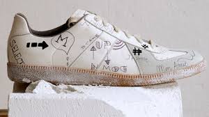 Originally founded by the elusive eponymous designer, today maison margiela is helmed by mr john galliano. Fashion Inspiration Maison Margiela Revisits One Of Its Most Iconic Sneaker Models Vogue Paris