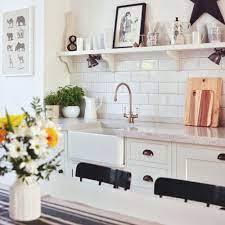 The black marble countertops pop against the traditional white cabinetry. White Kitchen Ideas 22 Schemes That Are Clean Bright And Timeless