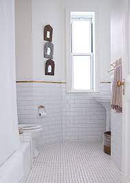 See how top designers create lovely loos with marble, ceramic, porcelain and glass tile. Apartment Bathroom White Bathroom Tiles Bathroom Design Gold Tile