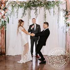 Michael Ray And Carly Pearce Didn T Let A Downpour Ruin Their Wedding Day The Rain Enhanced It Wedding Inside Wedding The Wedding Singer
