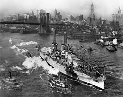 The USS *Arizona* (BB-39) passing under the Brooklyn Bridge on her first  voyage after being commissioned in 1916 would have been a historic moment.  The *Arizona*, a Pennsylvania-class battleship, was commissioned on **