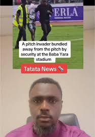 A pitch invader bundled like a welcome door mat during the Black stars...