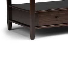 The pedestal stand not only makes it appear to float above the floor, but also makes it easy to get close to the table when you're sitting on the couch or the floor. Simpli Home Warm Shaker Coffee Table Brown 24 In X 48 In Axwsh001 Tb Rona