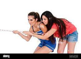 Two teens together in a Tug of War Stock Photo - Alamy
