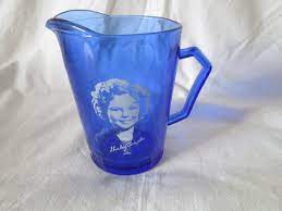 Cobalt blue shirley temple glassware was manufactured diring the mid 1930's by hazel atlas as promotional items for wheaties and bisquick. Vintage Cobalt Blue Shirley Temple Cream Pitcher Glass Carol S True Vintage And Antiques