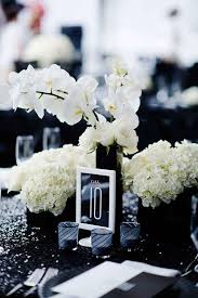 Black And White Wedding Decorations Cheap Black And White Framed Table Numbers Look Awesome In This Table Setting Black And White Wedding Theme White Wedding Centerpieces White Wedding Theme