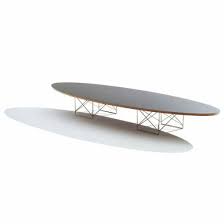 The eliptikal coffee table sits comfortably in front of a sofa or love seat or perhaps a row of chairs. Herman Miller Eames Elliptical Table
