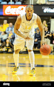 West Virginia's Gary Browne (14) brings the ball up the court during the  second half of an NCAA college basketball game Thursday, Nov. 21, 2013, in  Morgantown, W.Va. West Virginia won 101-68. (