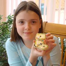 Many parents probably have a picture like this. Your little boy or girl,  proudly holding a homemade Christmas decoration. This picture shows the  beautiful, carefree girl Holly was, in happier times –