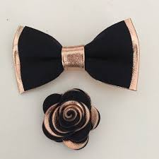Mens gold and navy blue tuxedo jacket floral pattern with shawl lapel. Rose Gold And Navy Blue Bow Tie And Boutonnieres Rose Gold Wedding Accessories Rose Gold Wedding Tuxedo Wedding Groomsmen