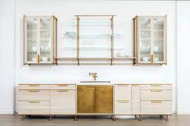 With a sleek steel frame and tempered glass on the desktop and shelves, this set pairs with a variety of decor. Uzivatel Amuneal Na Twitteru The Collector S Shelving Kitchen In Our Nyc Showroom In Warm Brass Bleached Oak With Ribbed Glass And Floating Glass Shelves Amuneal Https T Co Kpd0gxaf8f
