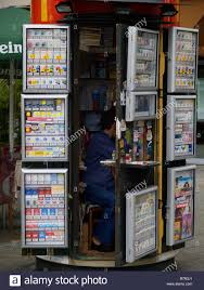 Small Cigarette Kiosk Or Shop With Shopkeeper Showing Through Door In Stock Photo Alamy