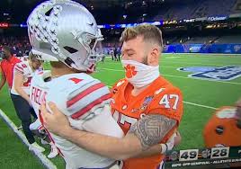 Classy: James Skalski shares hug with Justin Fields after Sugar Bowl