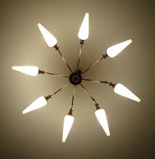 Fueled by advancements in mass production and innovative new materials (think plastics and molded plywood), designers began to radically experiment with shape, color and function to create some of the most iconic designs we now know today. Mid Century Danish Modern Pendant Light 1960s Brass Teak Glass Stilnovo Style