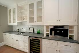 Pigments create concrete countertops in virtually any color, and the addition of colored stones or glass to the wet mix results in terrazzo or mosaic effects. White Kitchen Cabinets Concrete Countertop Grey Backsplash Pantry Design Dark Kitchen Cabinets Espresso Kitchen Cabinets