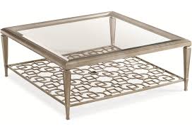 And with its scalloped edge, arrow feet, and weathered details, this table is perfect for a little french country style in any space. Caracole Caracole Classic 608147143 Sociables 50 Inch Square Cocktail Table With Pierced Display Shelf And Clear Glass Top Baer S Furniture Cocktail Coffee Tables
