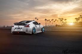 Nissan 370z On Air Bags And Blue Avant Garde Rims With Images Nissan 370z Nissan Air Bag