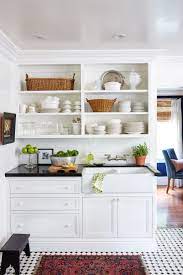 First, try painting small cabinets white. 10 Must Follow Rules For Making A Small Space Beautiful Small Cottage Kitchen Tiny House Kitchen Kitchen Layout