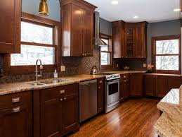 Select a splashy countertop color, such as aqua, or go for a sophisticated monochromatic look using slate or stainless steel. Grey Walls With Dark Brown Kitchen Cabinets Novocom Top