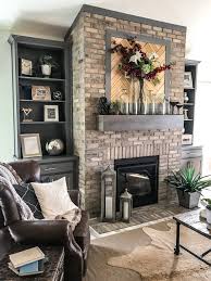 A Warm And Cozy Living Room Featuring An Updated Traditional Brick Fireplace Cozy Living Room Warm Fireplace Mantle Decor Cozy Living Rooms
