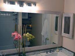 Give an old bathroom vanity a fresh new look with vinyl wallpaper. How To Replace A Bathroom Light Fixture How Tos Diy