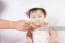 Shirts, pants, shoes, jackets, hats, accessories, and more! Cropped Hand Of Parent Pointing At Cute Toddler Daughter Sitting On Bed High Res Stock Photo Getty Images