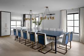 A dining room chandelier (or other hanging fixture) traditionally hangs above the center of the dining table and is a primary design feature in the room. Two Chandeliers Over Dining Table Design Ideas