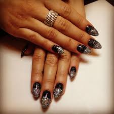 New Years Nails Black And Glitter Stilettos Almond Acrylic Nails Nails New Year S Nails