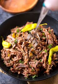 Slow Cooker Shredded Italian Beef Tangy And Spicy This Italian Beef Is Easily Cooked In Slow Cooker Italian Beef Italian Beef Recipes Italian Beef Crockpot