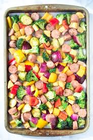 Andouille sausage, chicken, and vegetables are sauteed, and then the seasonings, stock, canned tomatoes, and rice are added and pressure cooked. Sausage And Veggies On A Large Baking Sheet Chicken Sausage Recipes Aidells Sausage Recipe Recipes