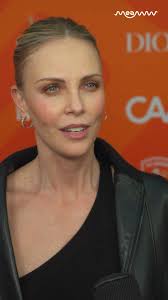 Charlize Theron talks about her Africa Outreach Program and the impact of  community., #charlizetheron #charlizetheronfans #redcarpetinterview  #africaoutreachprogram