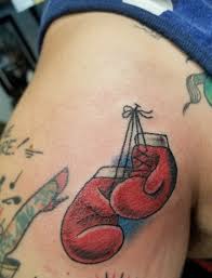 Represent the fight that those affected by cancer have challenged. Boxing Gloves Neck Deep Tattoo