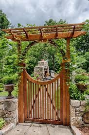 Asian Landscape Yard With Arbor Gate Saloon Door Trellis Wood Gate Fence Wooden Gate With Curved Fe Wooden Garden Gate Garden Gate Design Asian Landscape