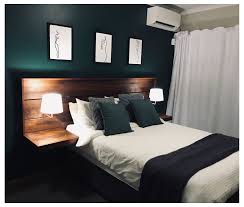 Pull this set together by anchoring the room with a few strategic pieces of bedroom furniture in dark wood and black accent. Emerald Green Feature Wall In The Bedroom Wood And White Bedroom Furniture Woodandwhiteb In 2021 Green Master Bedroom Green Bedroom Decor Green And White Bedroom