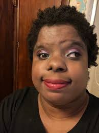 Soft glam makeup look with glossy lips and matte wings