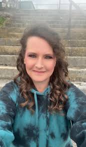 Create image of mother with angel wings and butterfly?