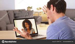 Man Webcamming Friend Laptop Stock Photo by ©mark@rocketclips.com 222841116