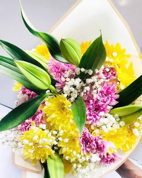 Fresh handcrafted floral arrangements delivered in Lagos, AI generated