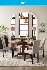 Unwind While You Dine With The Modern Relaxed Style Of Our Heritage Round Extension Dining Table A Round Dining Room Round Dining Room Table Gray Dining Chairs