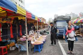Is there any one who need any help about korean related? A Police Officer Browses A South Korean Market Danbi Says Many Of The Goods Sold Here Can Also Be Found In North Korean Markets