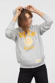 Features pronounced sleeve cuffs, prominent waistband hem and kangaroo pocket fringes. Printed Hoodie Light Gray Melange Ucla Ladies H M Us Ucla Sweatshirt Printed Hooded Sweatshirt Sweatshirts