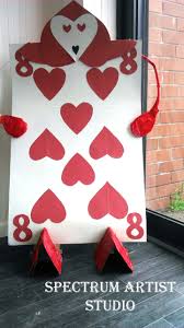 Love this hearts playing card flower for your hair! Queen Of Hearts Card Army Alice In Wonderland Craft Card Queen Of Hearts Card Love Cards Heart Decorations
