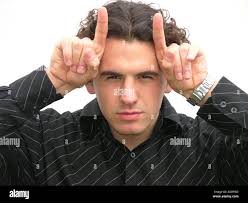 Devil horn fingers hi-res stock photography and images