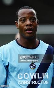 Junior Agogo of Bristol Rovers holds off Chris Willmott of... News Photo